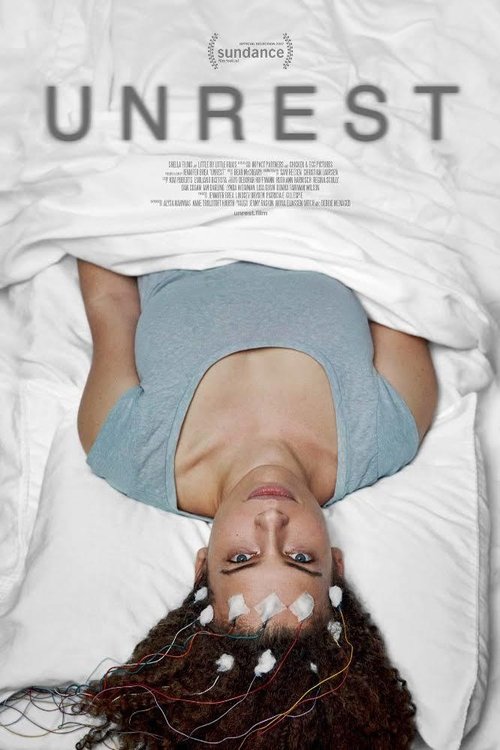 The poster features a woman lying upside down, her face and hair exposed against a white sheet. The muted blue shirt contrasts with the stark white background, creating a somber mood. The title "UNREST" is prominently displayed at the top in bold, uppercase letters.