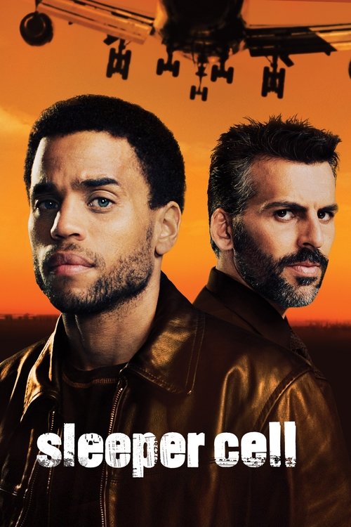 The poster features two men in leather jackets against a warm sunset backdrop, evoking a gritty, suspenseful atmosphere. The title "Sleeper Cell" is prominently displayed in bold white letters, hinting at a high-stakes thriller.