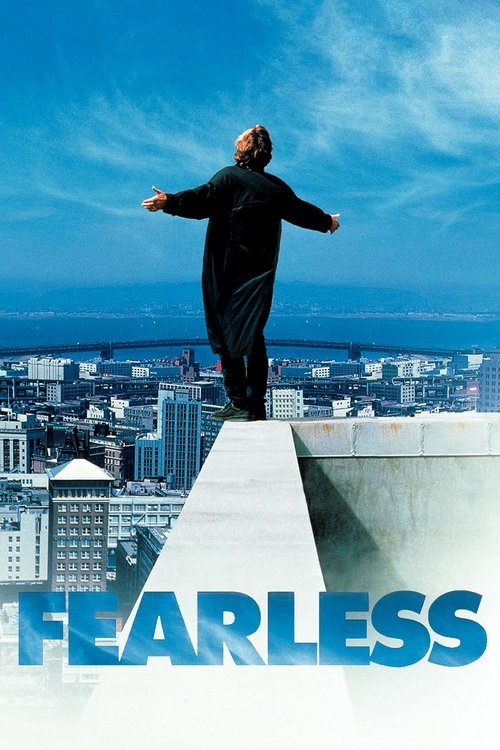 The poster features a lone figure standing atop a high-rise building, arms outstretched against a vast, serene sky. The bold blue title "Fearless" anchors the bottom, evoking a sense of freedom and courage.