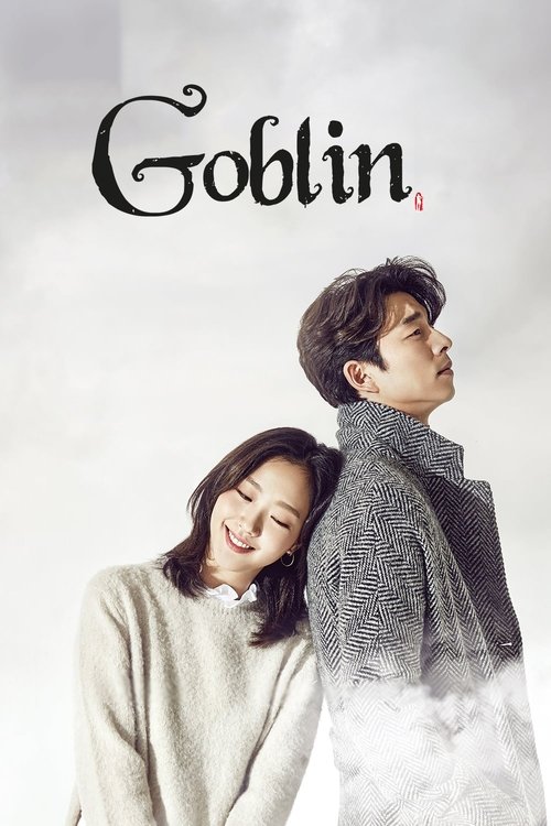 The poster features two characters in a cozy, snowy scene. The woman wears a light sweater, while the man dons a textured scarf. The muted tones of gray and white evoke a dreamy, melancholic mood. The title "Goblin" is elegantly displayed in the top left corner.