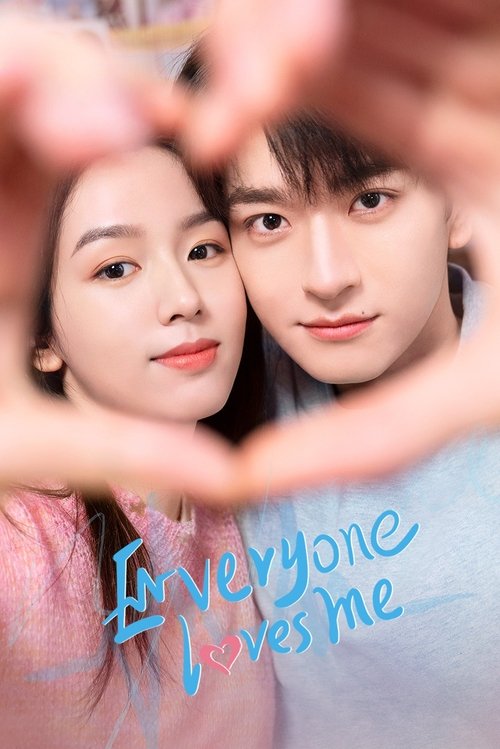 The poster features two young people smiling warmly against a soft, dreamy background. Their hands form a heart shape, framing their faces and conveying affection. The title "Everyone Loves Me" is written in a playful, handwritten style in blue, adding a personal touch. The overall mood is sweet,...