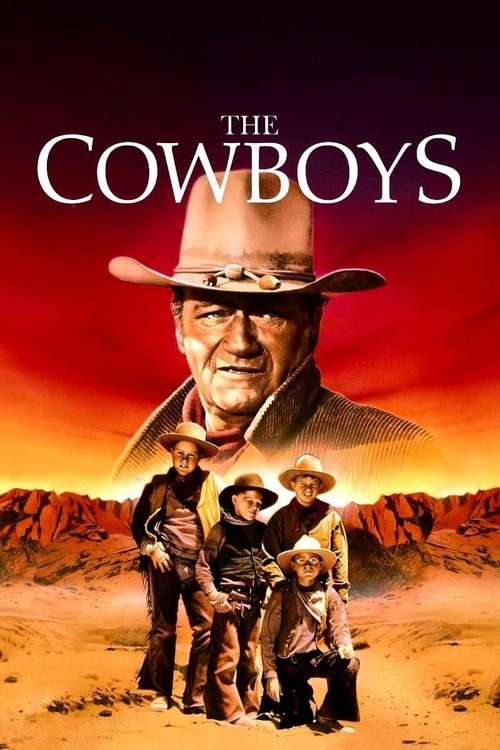 The poster features a rugged cowboy in a wide-brimmed hat against a fiery sunset, with a smaller group of four men standing below him in a desert landscape. The warm orange and red hues evoke a sense of adventure and danger, while the bold title "The Cowboys" sets the tone for a classic Western m...