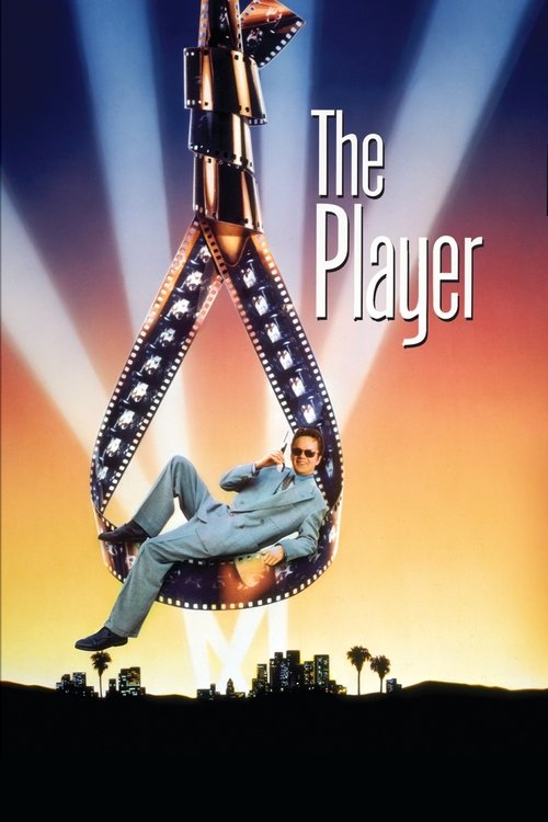The poster features a man in a blue suit suspended in a film reel, surrounded by dramatic light beams against a sunset sky. The title "The Player" is prominently displayed in bold white letters. The overall mood is mysterious and cinematic, evoking themes of suspense and intrigue.