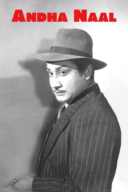 The black-and-white poster features Andha Naal in a stylish pinstripe suit and fedora, exuding sophistication. Bold red text at the top emphasizes his name, while the soft lighting highlights his contemplative expression.