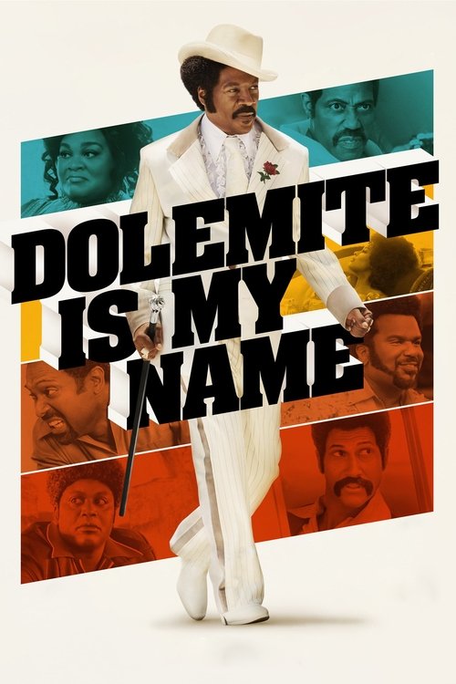 The poster features a man in a white suit and hat, exuding confidence against a vibrant backdrop of colorful faces. Bold text overlays the image, emphasizing the movie's title. The dynamic composition and bold colors create an energetic and humorous mood, suggesting a comedic or satirical tone.