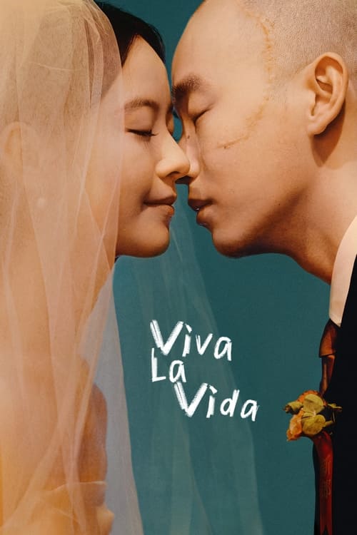 The poster features a tender close-up of a couple sharing an intimate moment, their faces pressed together in a gesture of deep connection. The warm tones of the image, with soft lighting and a gentle blue background, evoke a sense of romance and warmth. The title "Viva La Vida" is elegantly disp...