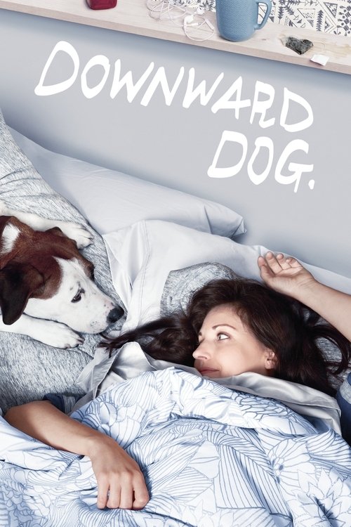 A young woman lies in bed with her dog, both looking up at the camera. The poster features soft blue bedding and a cozy, intimate mood. The title "Downward Dog" is written in elegant white script.