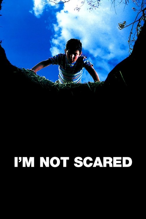 The poster features a person climbing over a dark, rocky ledge against a bright blue sky with scattered clouds. The bold white text "I'M NOT SCARED" anchors the image, conveying a sense of courage and resilience.
