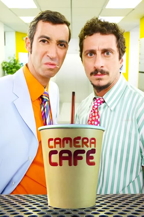 Two men stand in front of a "Camera Café" cup with a red straw, one in a white coat and orange shirt, the other in a striped shirt with a mustache. The scene is bright and cheerful, capturing a humorous moment with a playful, comedic mood.