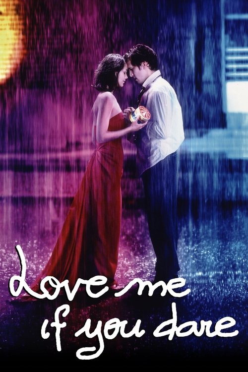 The poster features a romantic couple embracing under a rain-slicked street at night, bathed in purple and blue hues. The title, "Love Me If You Dare," is elegantly written in white script at the bottom, evoking a dreamy, passionate atmosphere.