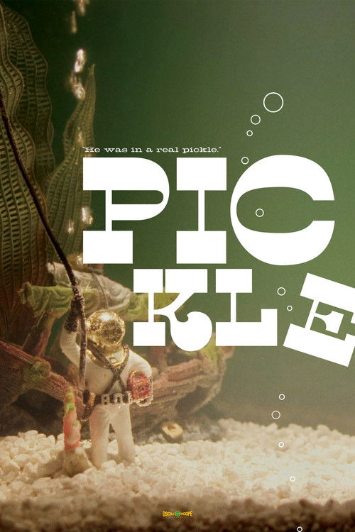 The poster features a surreal scene with a small astronaut figure amidst a sandy beach, set against a dark green backdrop. The bold white text "PICKE" dominates the frame, creating a striking contrast. The overall mood is whimsical and dreamlike, evoking a sense of wonder and adventure.