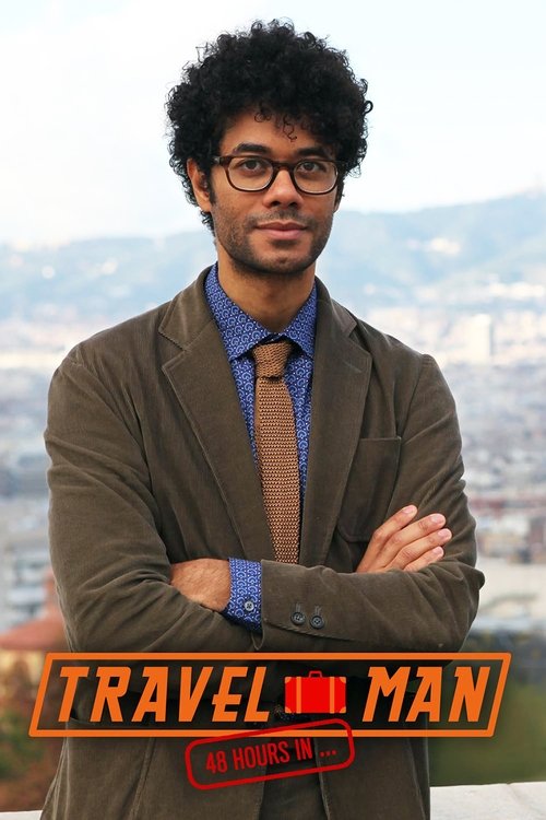The poster features a man with curly hair and glasses, wearing a brown jacket over a blue shirt and tie. He stands with arms crossed, exuding confidence. The background shows a scenic view of mountains and cityscape. The bold orange text at the bottom reads "TRAVEL MAN: 48 HOURS IN..." with a red...