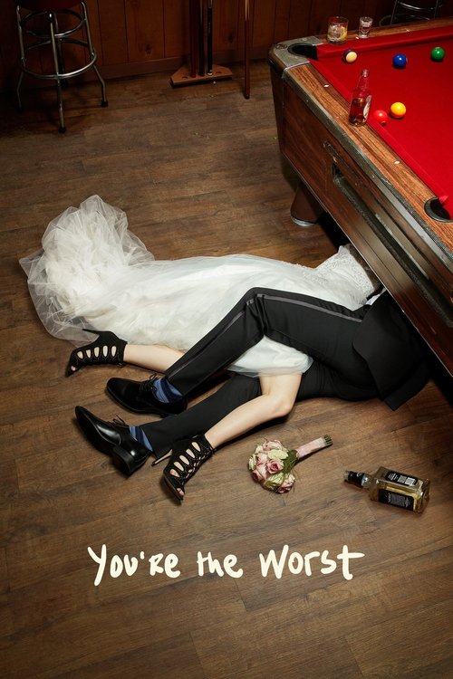 A woman in a white dress and black heels lies on the floor near a pool table, with a small bottle and a phone nearby. The scene exudes a dark, mysterious mood, suggesting a thriller or drama.