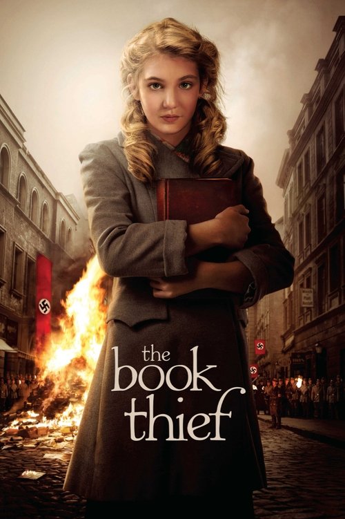 The poster features a young woman with blonde hair holding a book, standing against a backdrop of burning debris and burning buildings. The warm, golden lighting contrasts with the fiery orange flames, creating a dramatic and intense atmosphere. The title "The Book Thief" is prominently displayed...