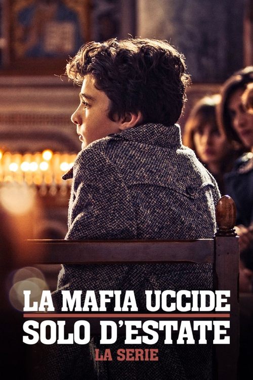 The poster features a young man in a patterned coat, looking off into the distance with a somber expression. Warm, golden lighting casts soft shadows, creating a moody atmosphere. The title "LA MAFIA UCCIDE SOLO D'ESTATE" is prominently displayed in bold, white letters against the dark background...