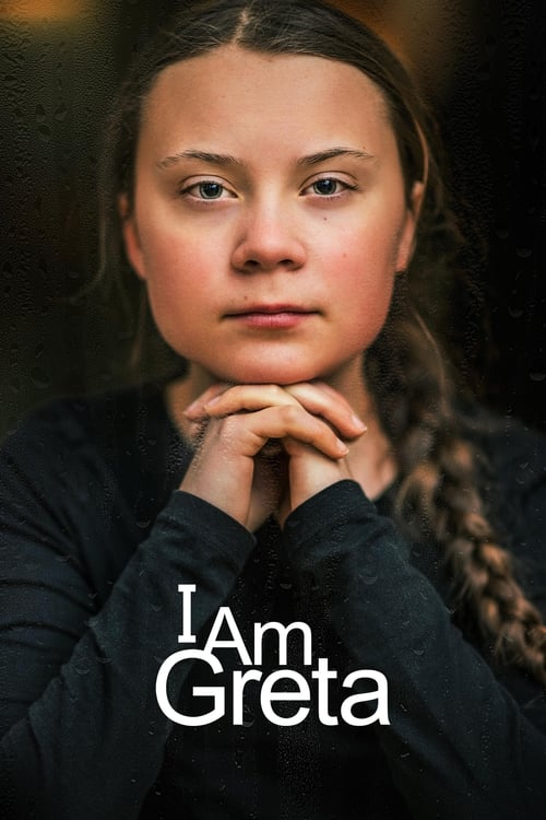 The poster features a young girl with a somber expression, her hands clasped in front of her face. She has dark hair tied back, and the image is set against a dark, moody background. The title "I Am Greta" is prominently displayed in white text at the bottom. The overall mood is serious and refle...