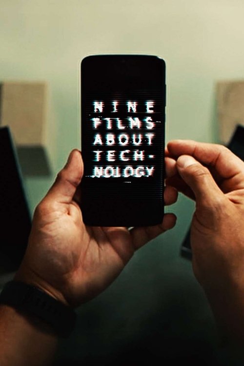 The image captures a close-up of hands holding a smartphone displaying the title "Nine Films About Technology" in bold, white text against a dark background. The muted, slightly grainy lighting and soft focus create a contemplative mood, emphasizing the intellectual and cultural significance of t...