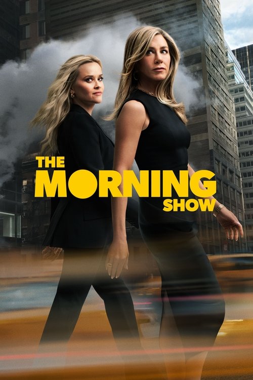 The poster features two women in black outfits walking confidently against a blurred city backdrop. The bold yellow text "THE MORNING SHOW" dominates the center, creating a striking contrast. The mood is energetic and professional, suggesting a high-stakes morning show setting.
