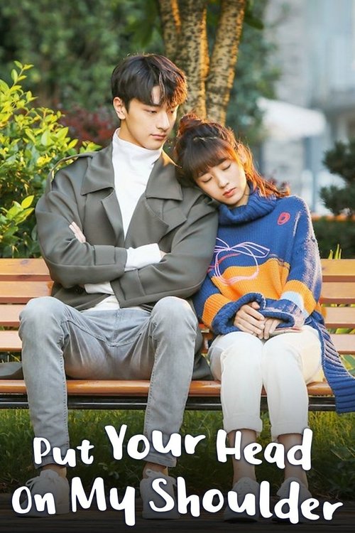 The poster features two people sitting on a wooden bench in a park setting. The man wears a gray jacket and white shirt, while the woman is dressed in a blue and orange top. The mood is romantic and intimate, with the woman resting her head on the man's shoulder.